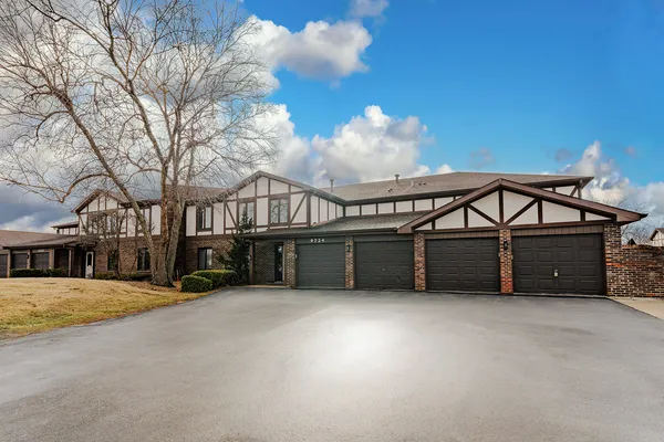 a view of a house with a snow in a yard