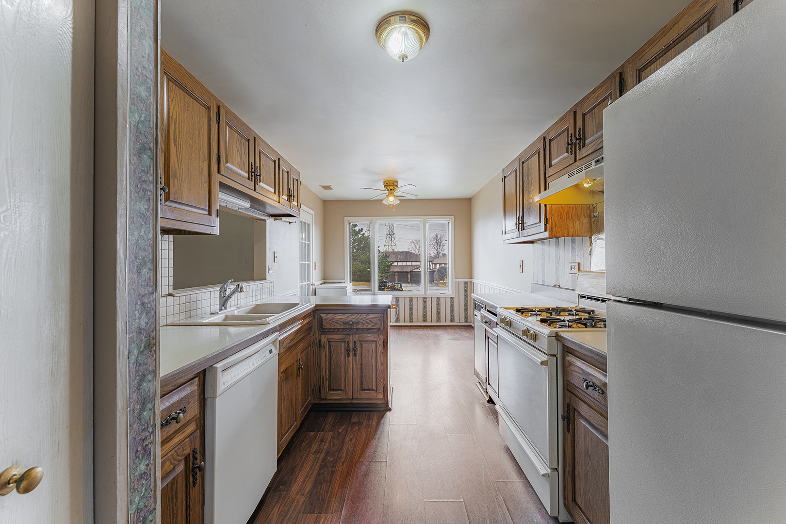 9724 West Creek Road, Unit B2 Palos Park, IL 60464 - Photo 11 of 22 a kitchen with stainless steel appliances granite countertop a stove and a sink