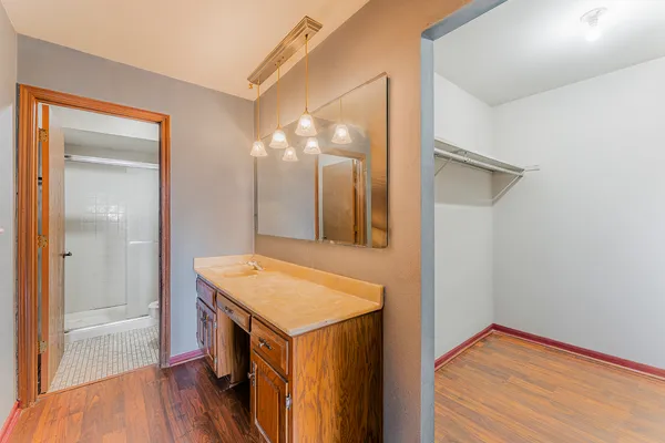 a bathroom with a sink a vanity and a mirror