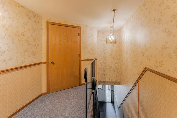 a view of a hallway with staircase