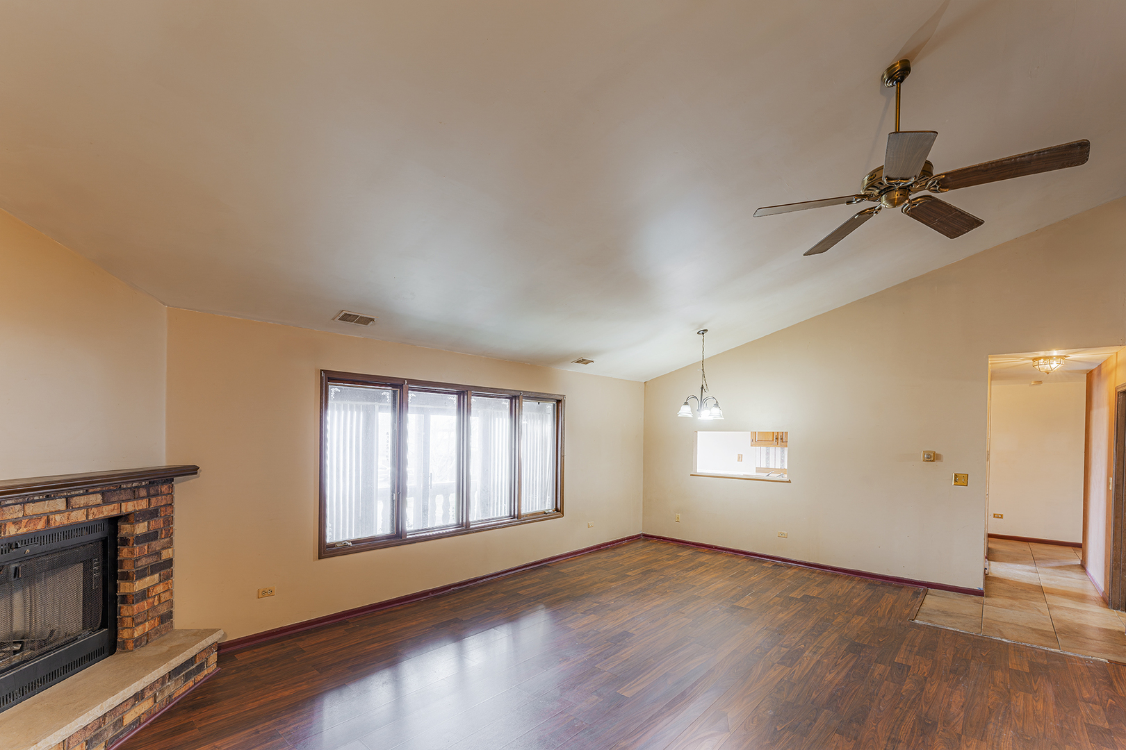 9724 West Creek Road, Unit B2 Palos Park, IL 60464 - Photo 2 of 22 a view of empty room with wooden floor and fan