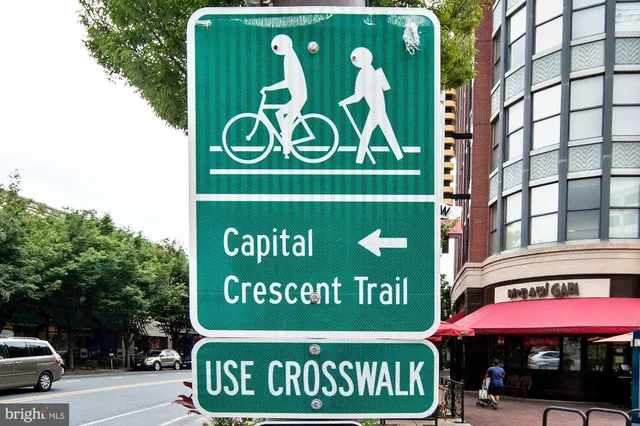 a view of a chairs and table in patio with a barbeque