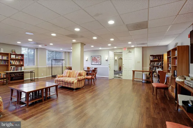 a view of swimming pool with outdoor seating