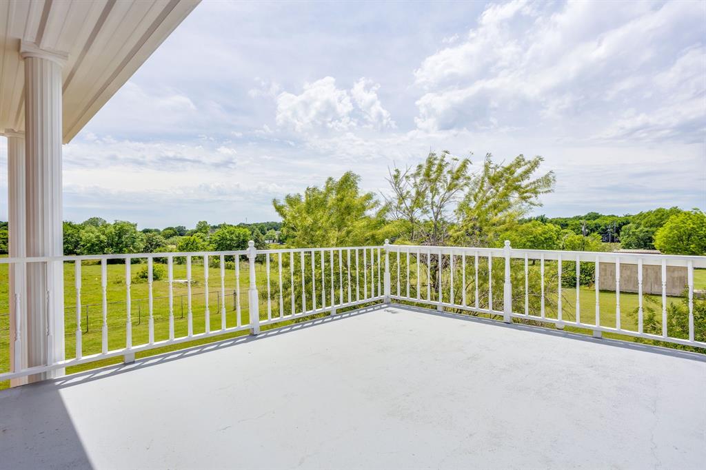 807 Caddo Road Joshua, TX 76058 - Photo 25 of 40 balcony off the upstairs primary bedroom