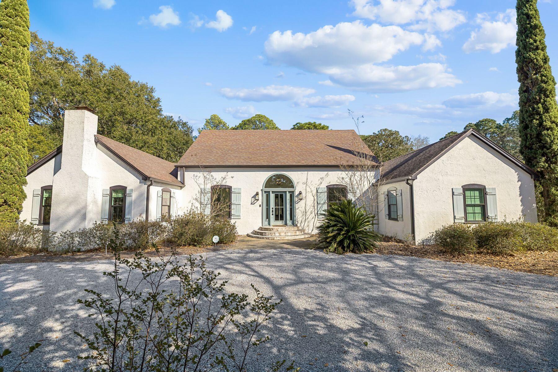 1525 West Hewett Road Santa Rosa Beach, FL 32459 - Photo 1 of 56 a view of a house with a yard