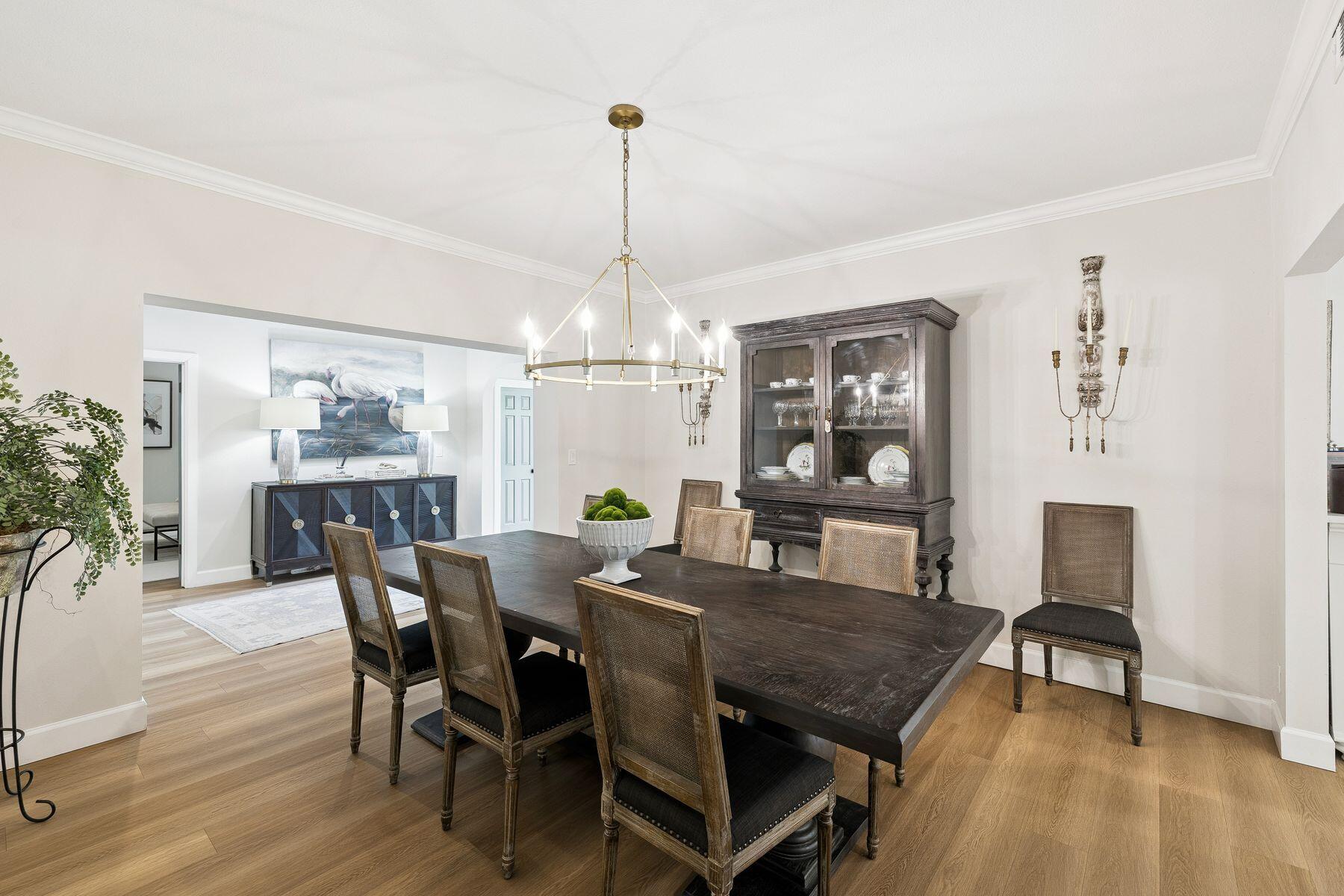 1525 West Hewett Road Santa Rosa Beach, FL 32459 - Photo 15 of 56 a view of a dining room with furniture window and wooden floor