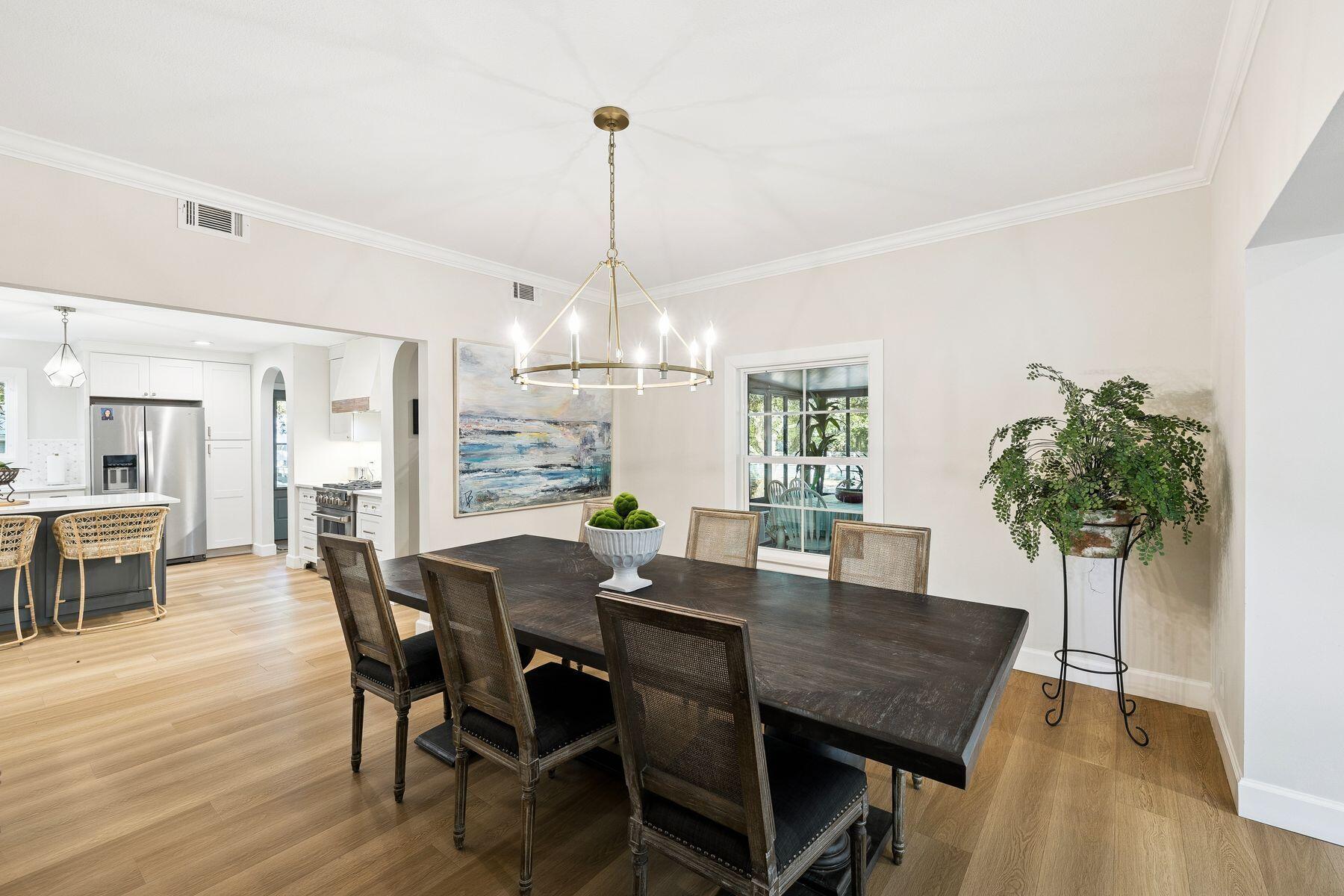 1525 West Hewett Road Santa Rosa Beach, FL 32459 - Photo 16 of 56 a view of a dining room with furniture window and wooden floor