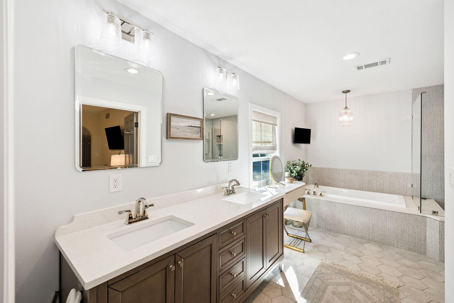 1525 West Hewett Road Santa Rosa Beach, FL 32459 - Photo 22 of 56 a bathroom with a sink double vanity granite tub shower and a mirror