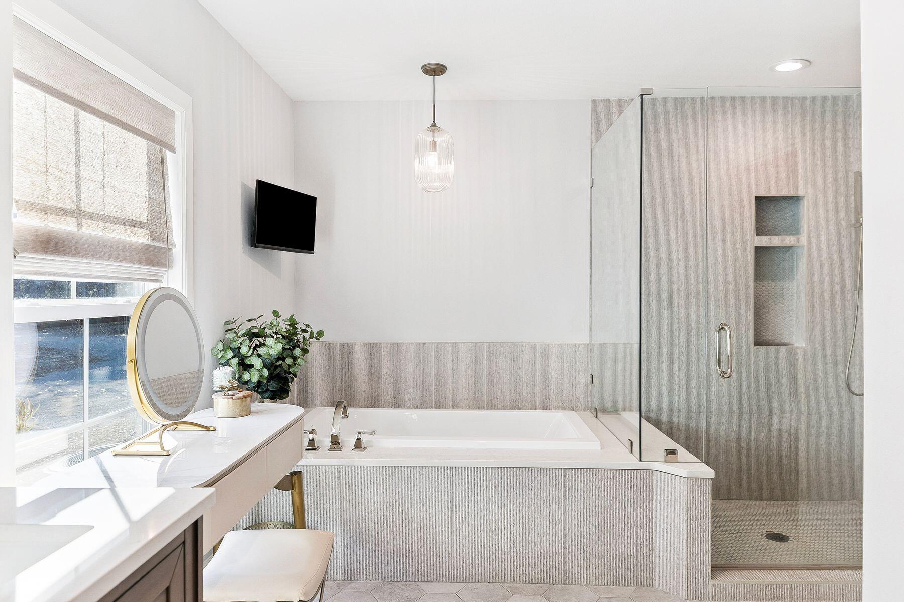 1525 West Hewett Road Santa Rosa Beach, FL 32459 - Photo 23 of 56 a bathroom with a tub a sink and a mirror