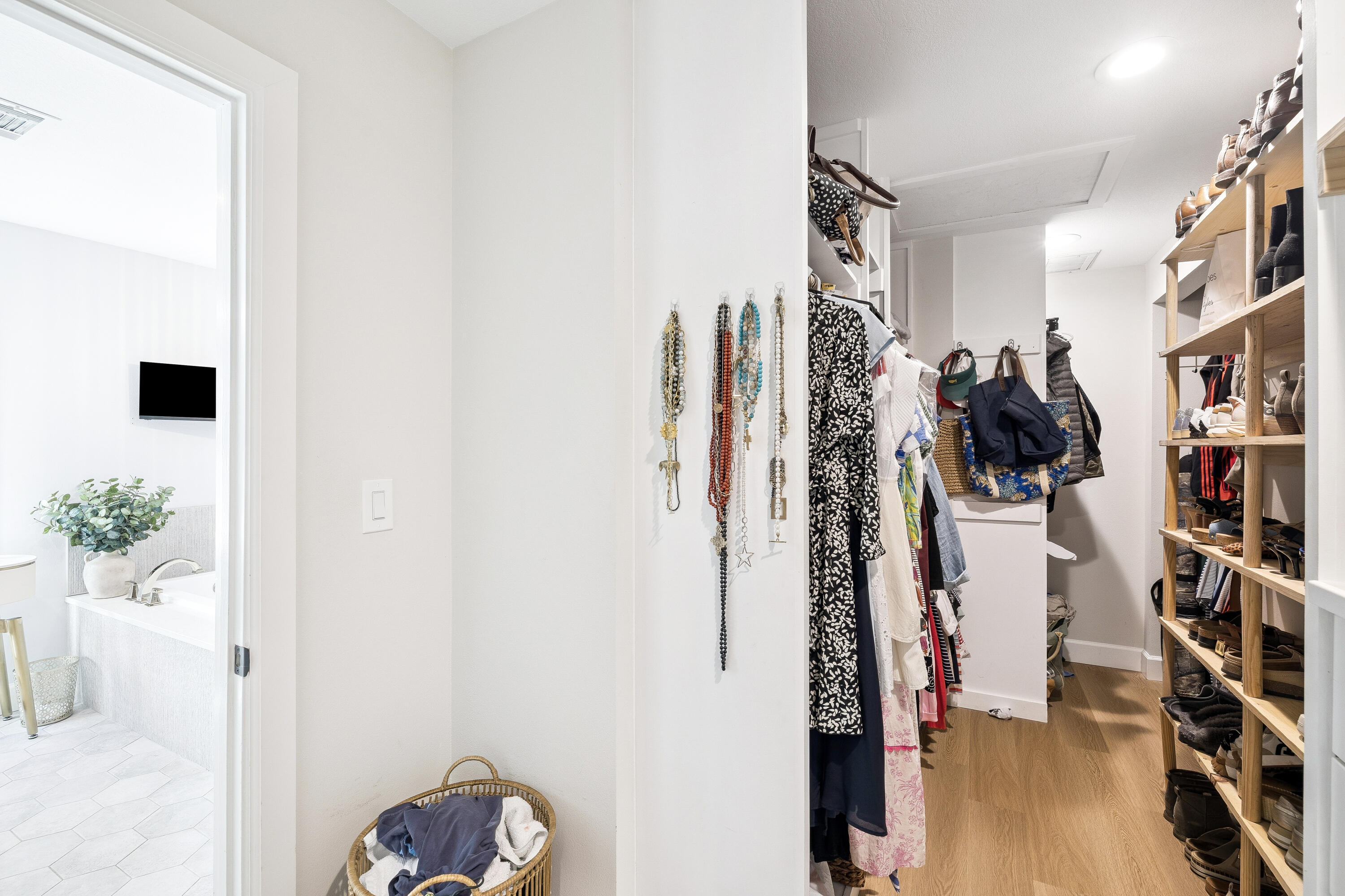 1525 West Hewett Road Santa Rosa Beach, FL 32459 - Photo 25 of 56 a view of walk in closet with clothes and shoes