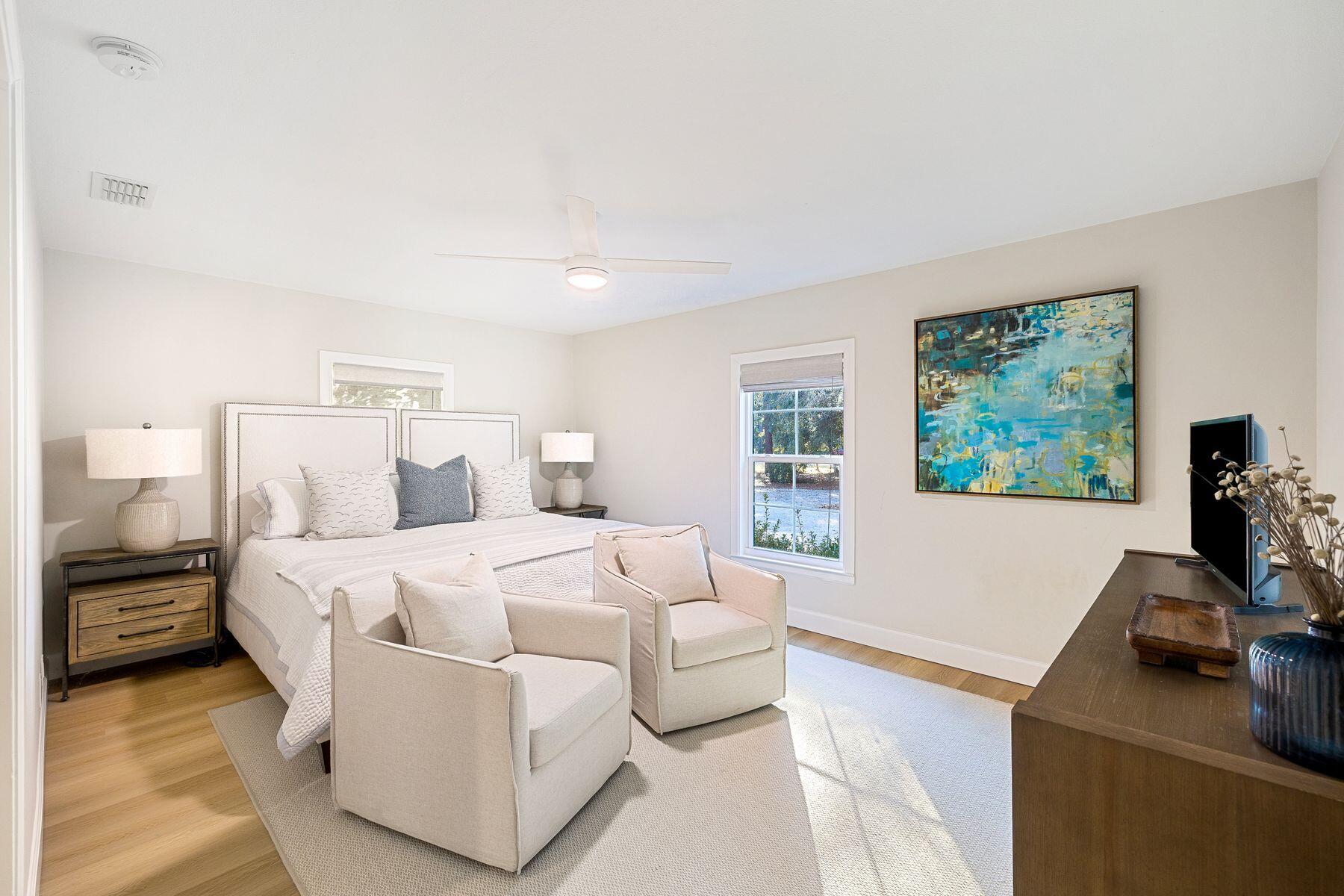 1525 West Hewett Road Santa Rosa Beach, FL 32459 - Photo 26 of 56 a bedroom with a bed and a flat screen tv