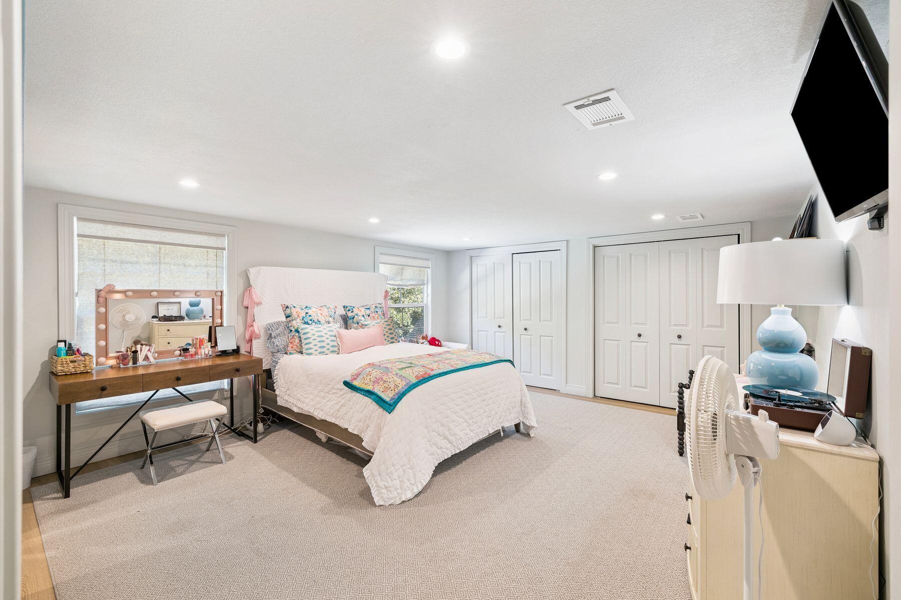1525 West Hewett Road Santa Rosa Beach, FL 32459 - Photo 29 of 56 a spacious bedroom with a bed and a flat screen tv