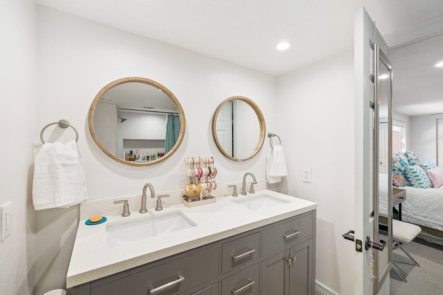 1525 West Hewett Road Santa Rosa Beach, FL 32459 - Photo 30 of 56 a bathroom with a sink and a mirror