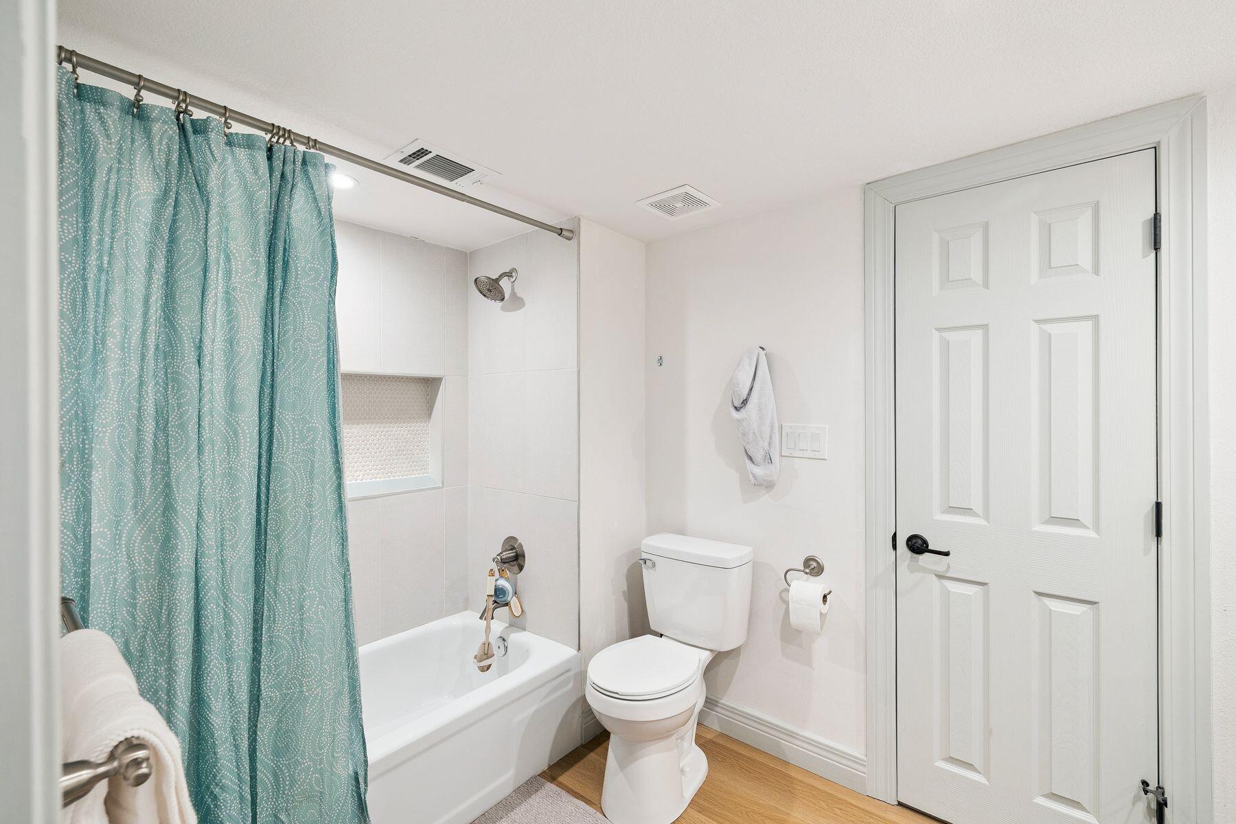 1525 West Hewett Road Santa Rosa Beach, FL 32459 - Photo 31 of 56 a bathroom with a toilet a sink and shower