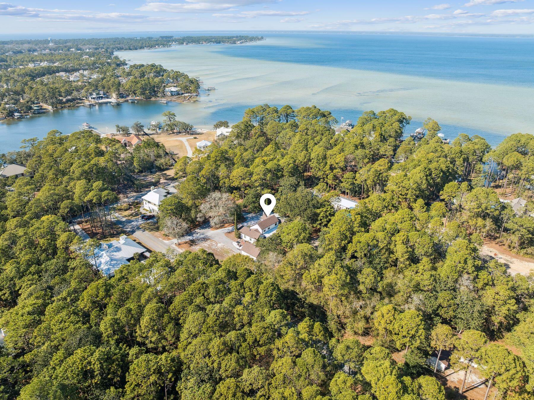 1525 West Hewett Road Santa Rosa Beach, FL 32459 - Photo 49 of 56 a view of a lake with a city