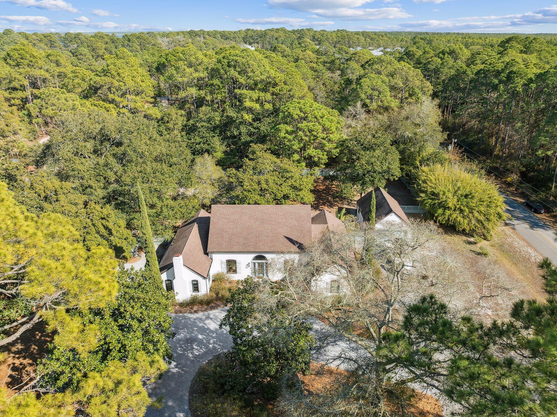 1525 West Hewett Road Santa Rosa Beach, FL 32459 - Photo 51 of 56 an aerial view of a house with a yard