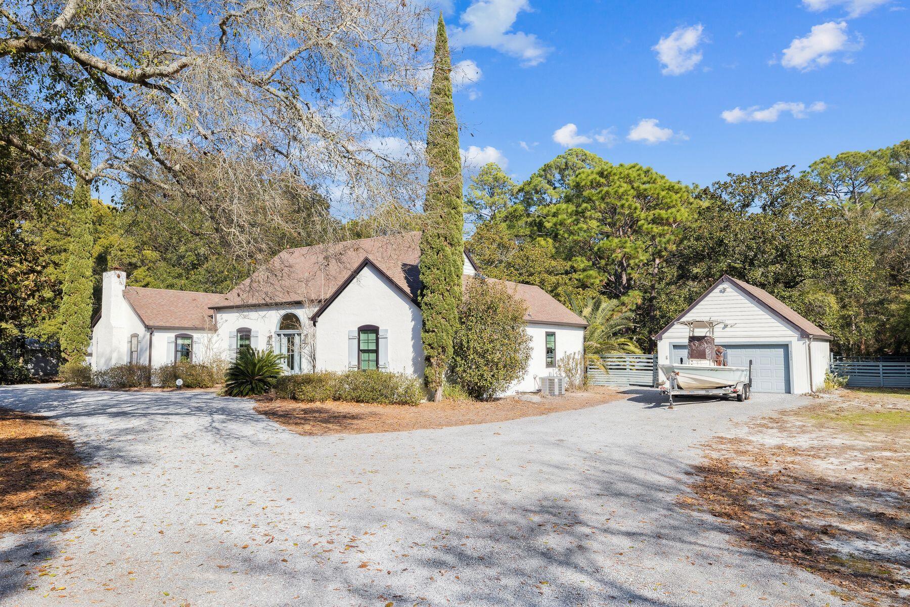 1525 West Hewett Road Santa Rosa Beach, FL 32459 - Photo 52 of 56 a view of large house with a large space in front of it