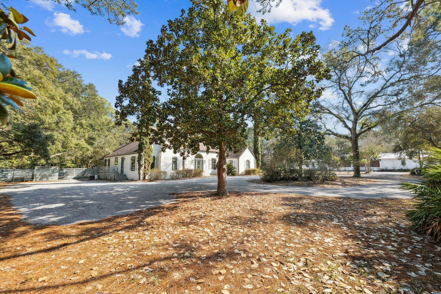 1525 West Hewett Road Santa Rosa Beach, FL 32459 - Photo 53 of 56 a street view with large trees