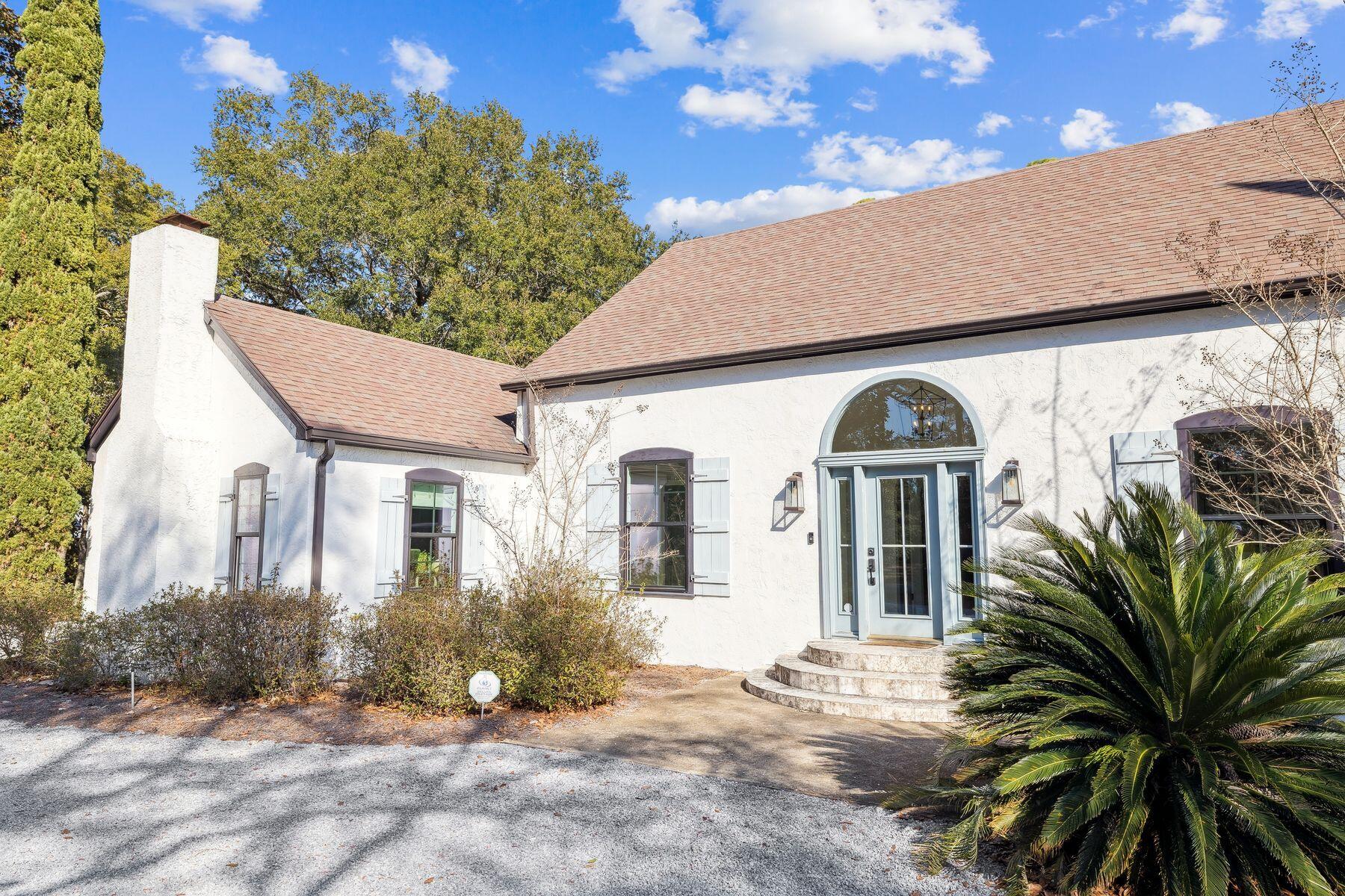 1525 West Hewett Road Santa Rosa Beach, FL 32459 - Photo 54 of 56 a front view of a house with garden