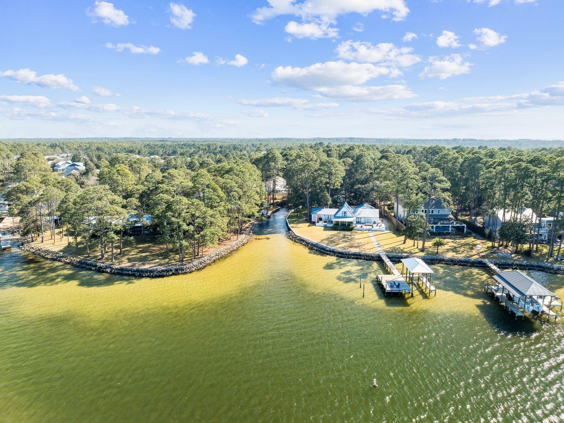 1525 West Hewett Road Santa Rosa Beach, FL 32459 - Photo 56 of 56 a view of a lake with lawn chairs