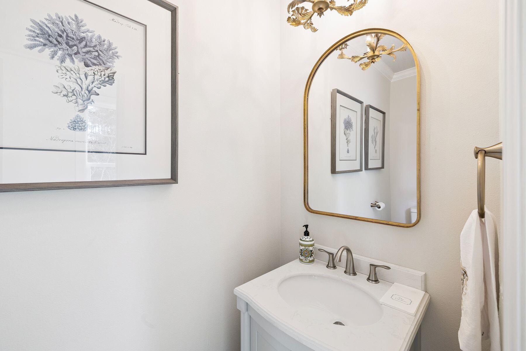 1525 West Hewett Road Santa Rosa Beach, FL 32459 - Photo 8 of 56 a bathroom with a sink and a mirror