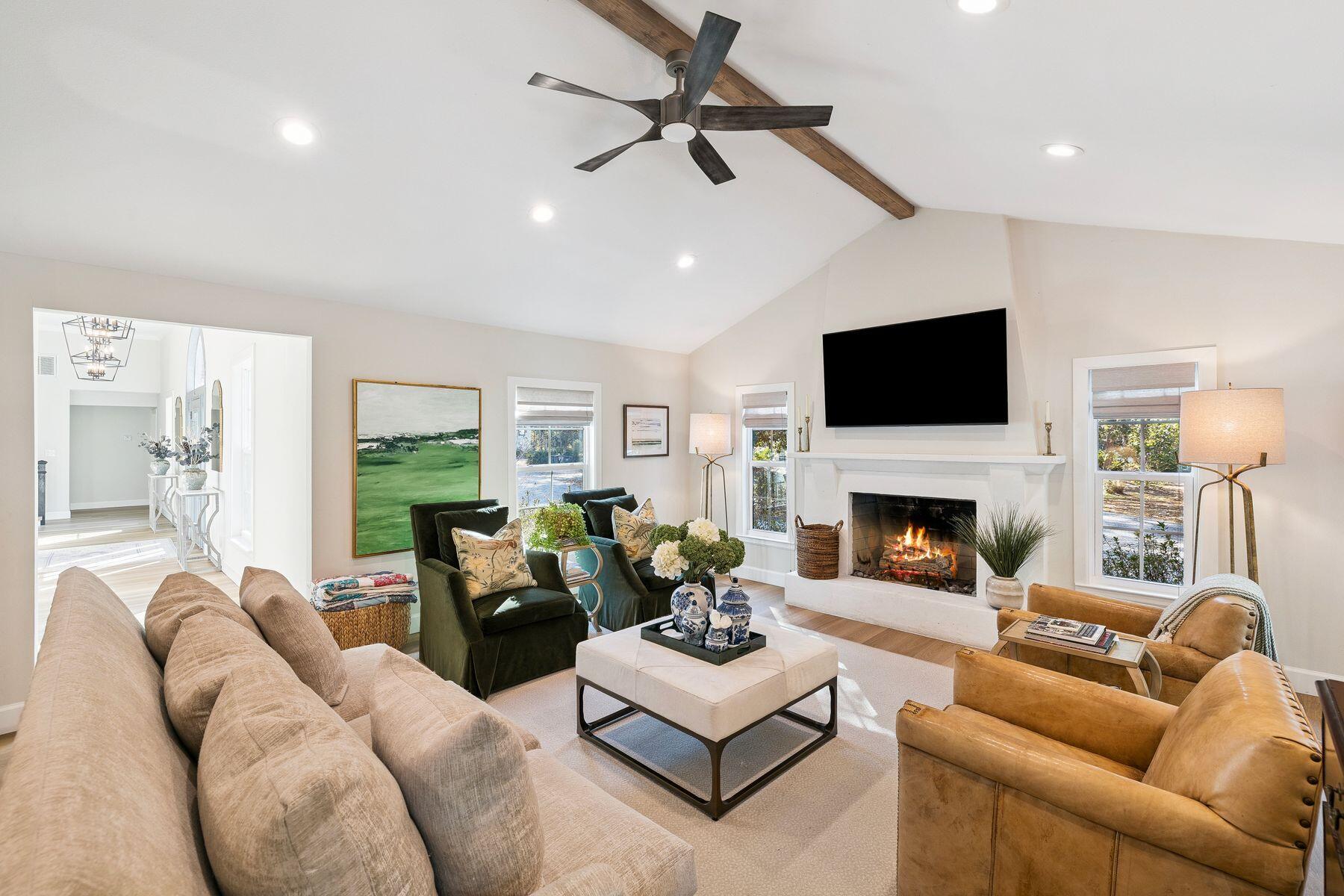 1525 West Hewett Road Santa Rosa Beach, FL 32459 - Photo 10 of 56 a living room with furniture a fireplace and a flat screen tv