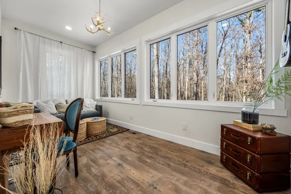 a large room with lots of counter space and wooden floor