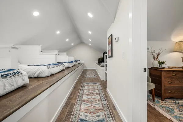 a bedroom with a bed and a couch