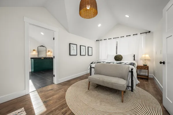 a living room with fireplace furniture and a floor to ceiling window