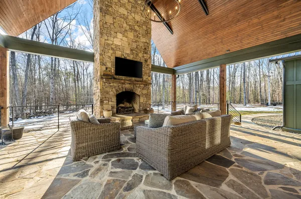 a view of a backyard with swimming pool