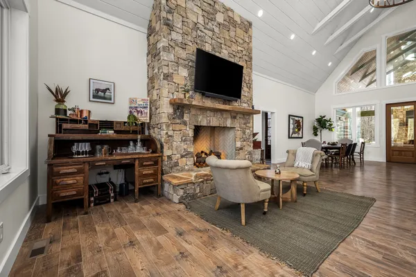 a living room with furniture and a fireplace