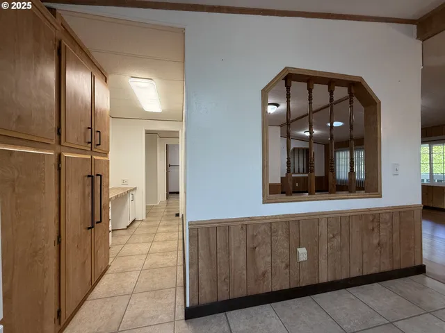 a kitchen with stainless steel appliances kitchen island granite countertop a stove a sink and a microwave