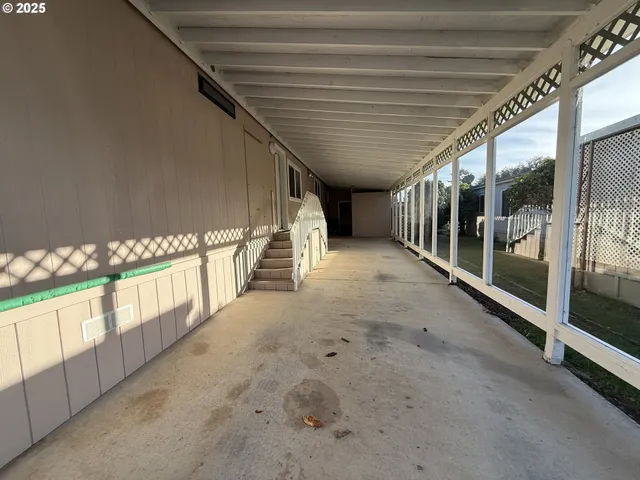 a view of a door and chair in the room