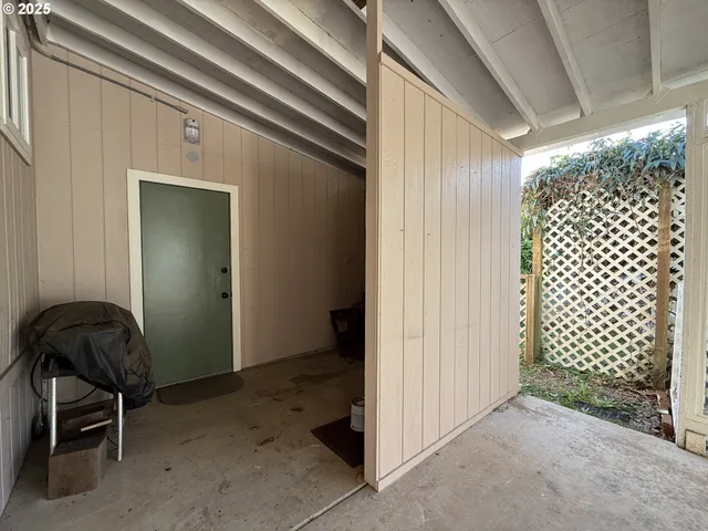 a view of a balcony with wooden floor