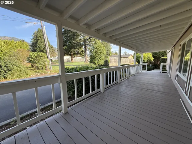 a view of a two chairs in the balcony