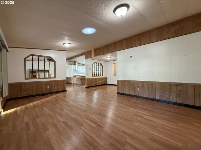 a view of a livingroom with wooden floor