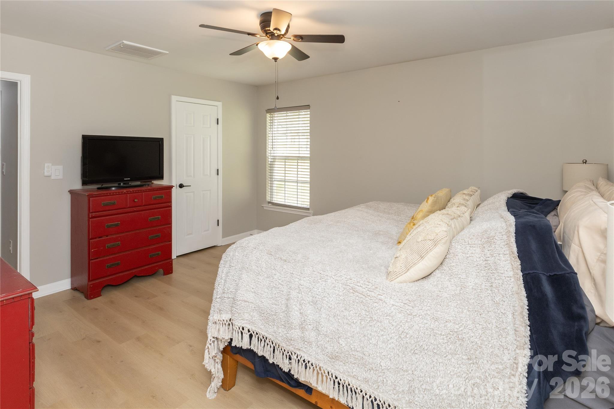 5126 Monroe-Ansonville Road Wingate, NC 28174 - Photo 14 of 28 a bedroom with a bed and a flat screen tv