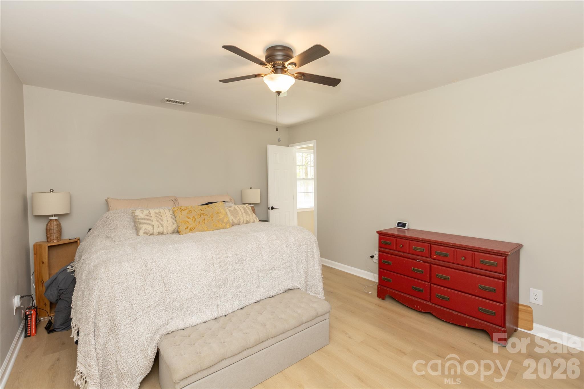 5126 Monroe-Ansonville Road Wingate, NC 28174 - Photo 15 of 28 a bedroom with a bed and a ceiling fan