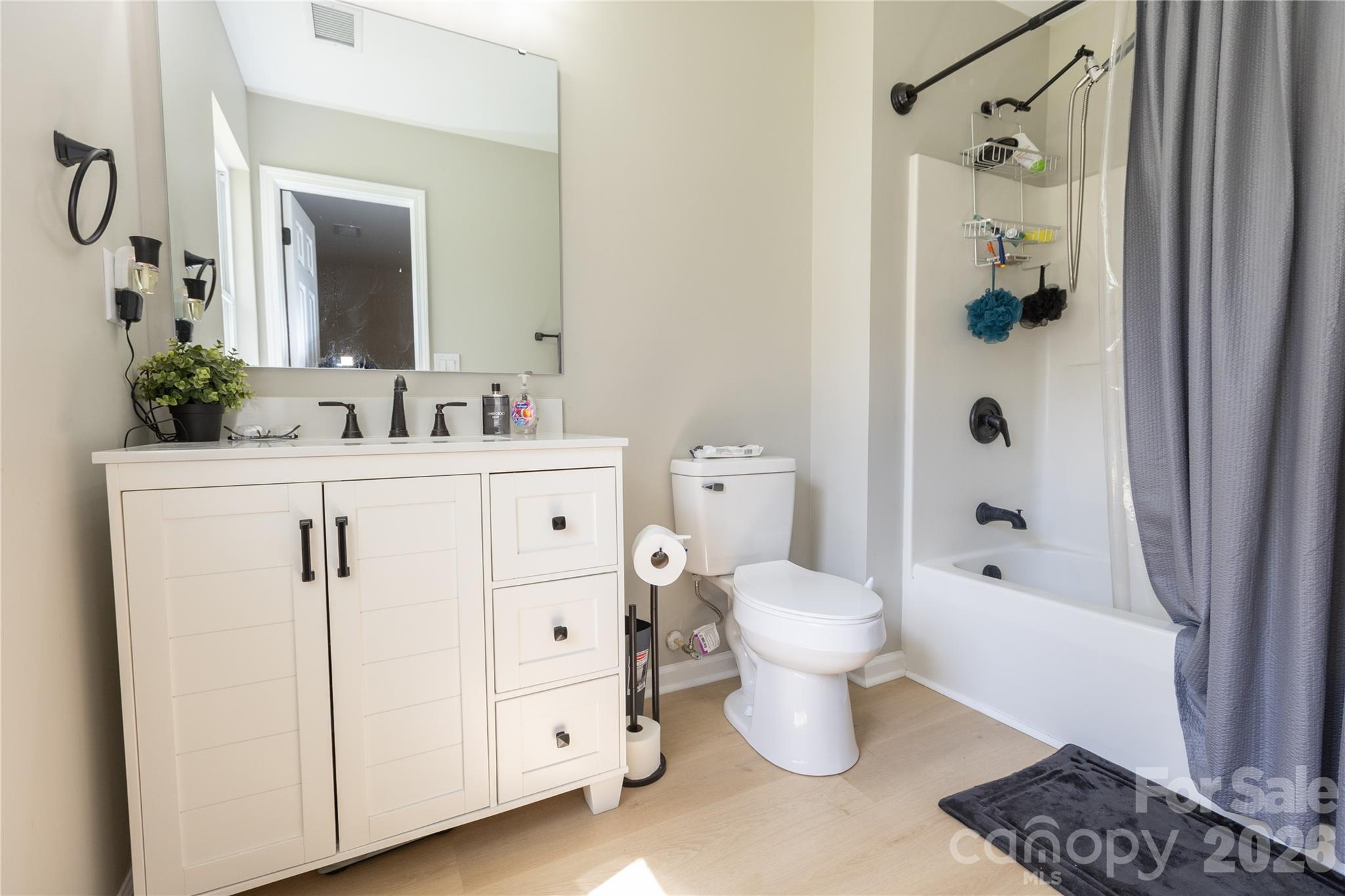 5126 Monroe-Ansonville Road Wingate, NC 28174 - Photo 21 of 28 a bathroom with a sink a toilet and shower