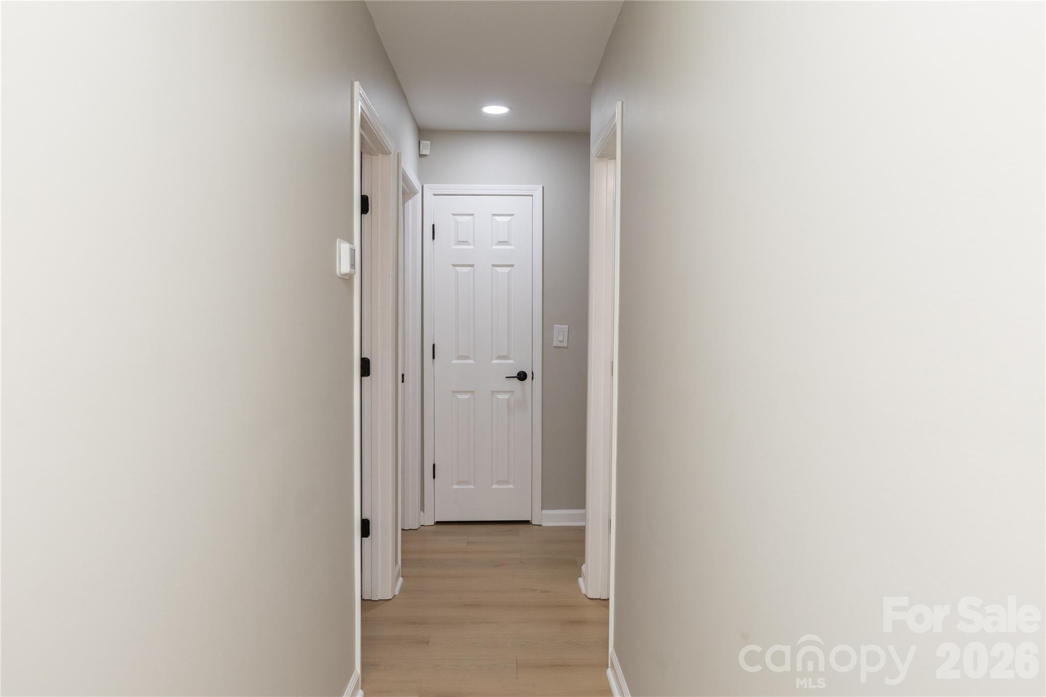 5126 Monroe-Ansonville Road Wingate, NC 28174 - Photo 26 of 28 a view of a hallway with wooden floor