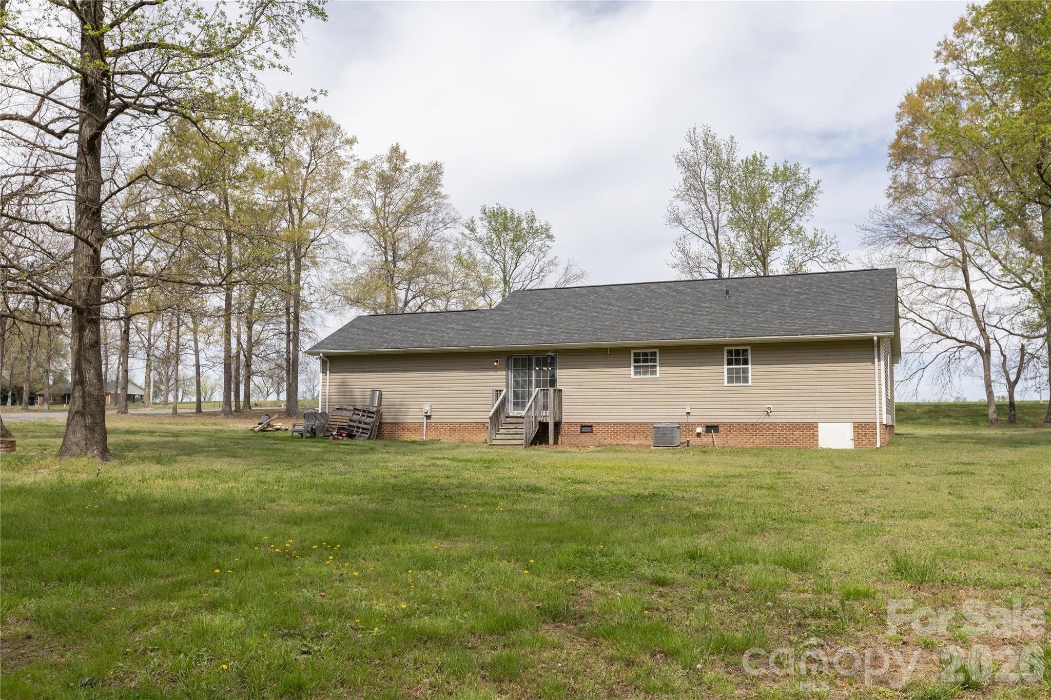 5126 Monroe-Ansonville Road Wingate, NC 28174 - Photo 28 of 28 a view of a house with a yard