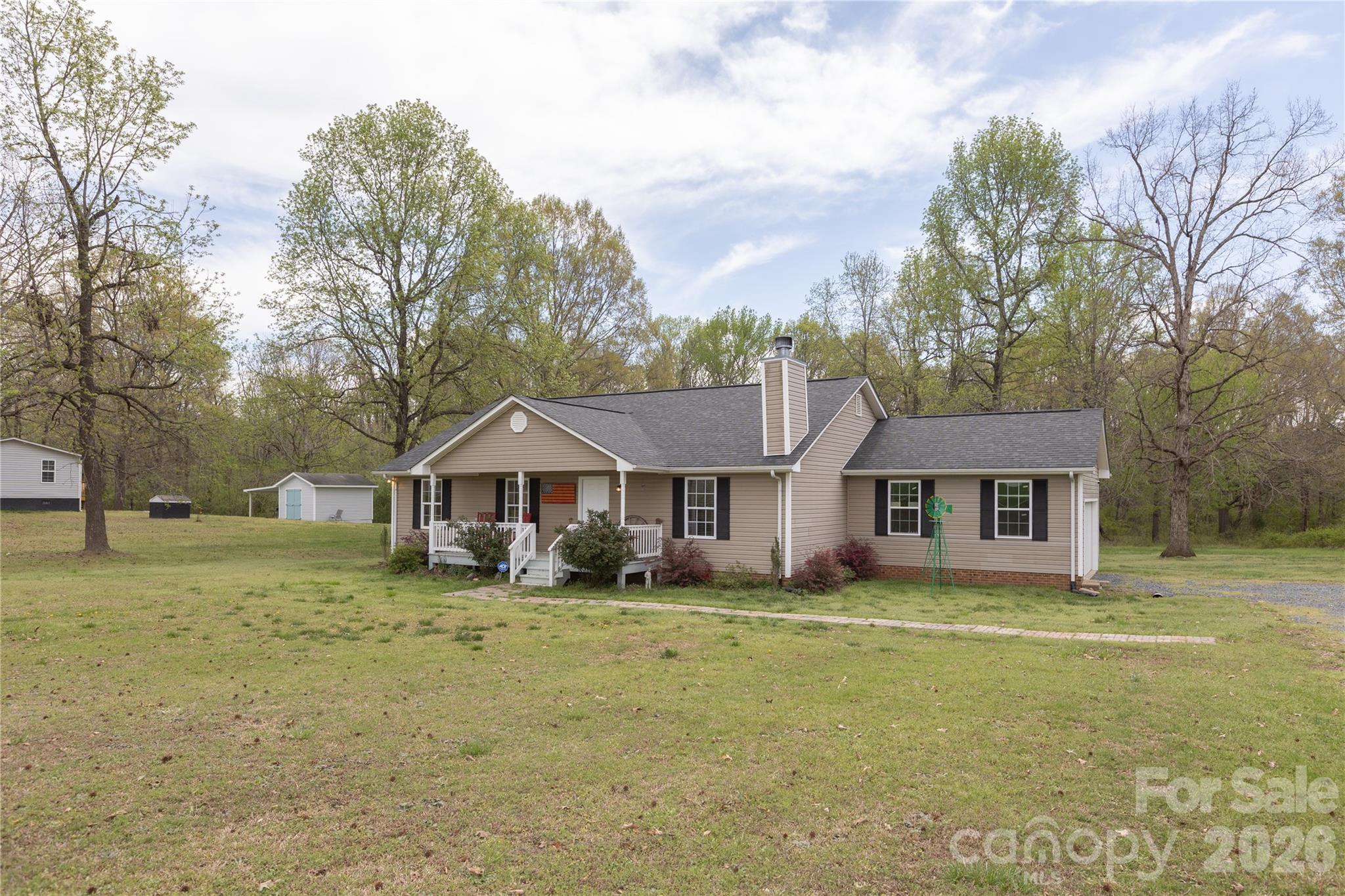 5126 Monroe-Ansonville Road Wingate, NC 28174 - Photo 3 of 28 a front view of a house with a yard