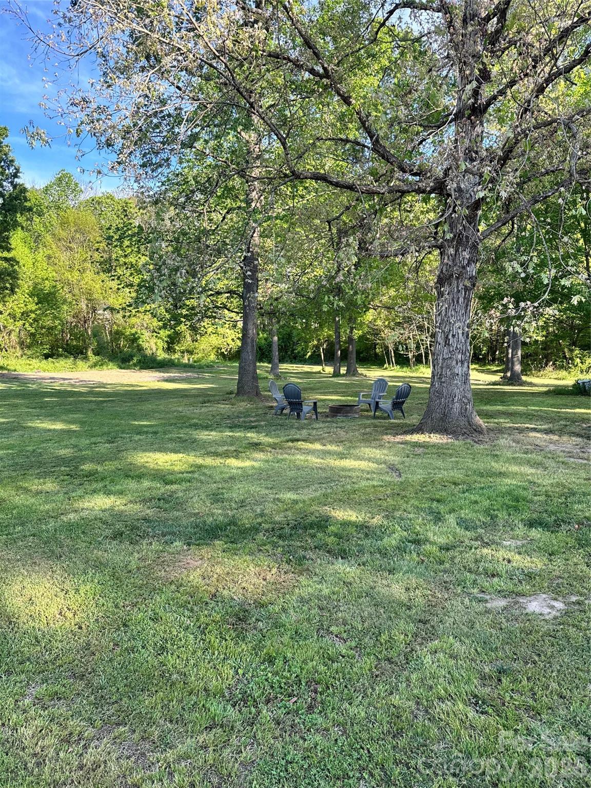 5126 Monroe-Ansonville Road Wingate, NC 28174 - Photo 4 of 28 a view of outdoor space with green field and trees all around