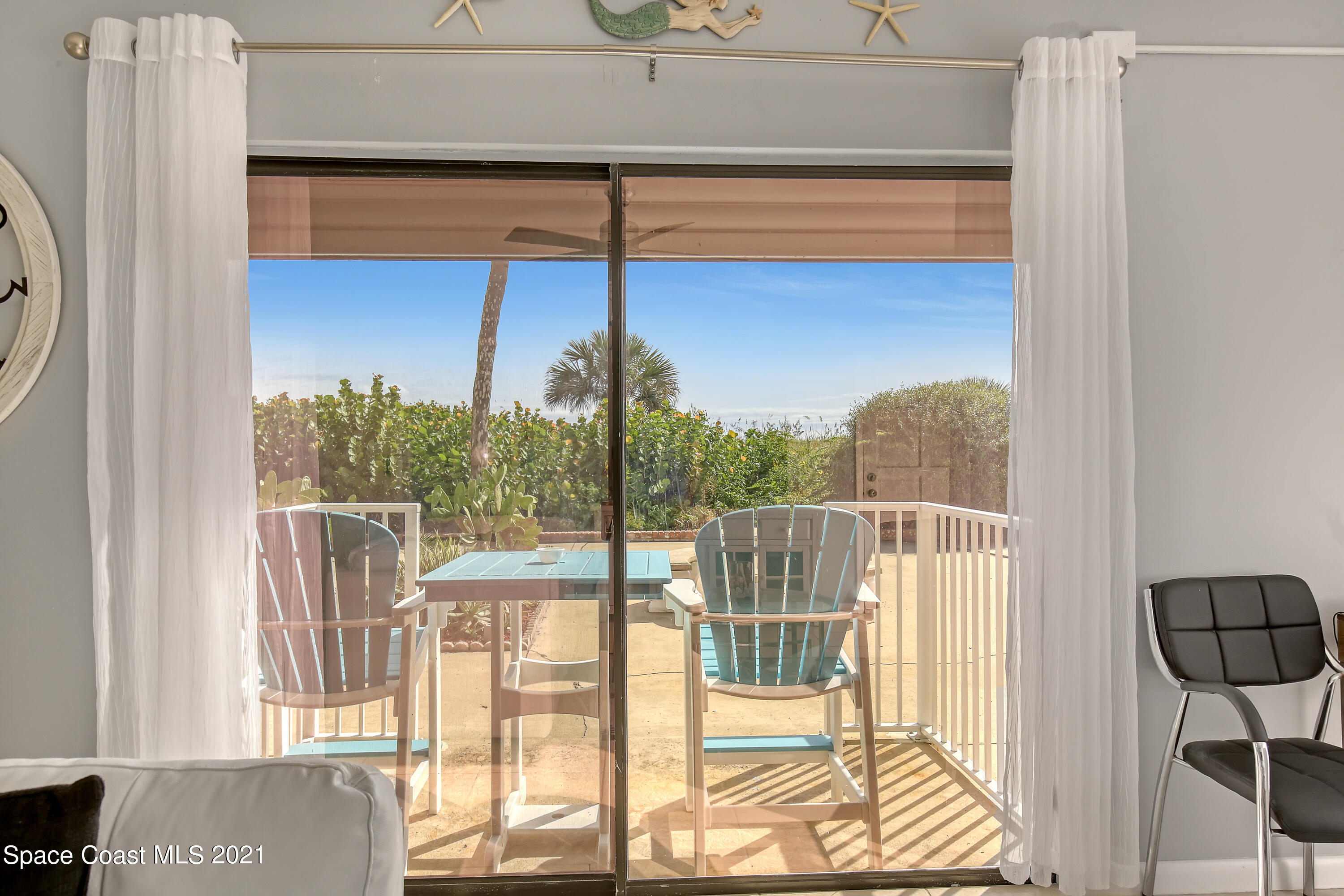 5000 Ocean Beach Boulevard, Unit C5 Cocoa Beach, FL 32931 - Photo 11 of 43 a view of balcony with two chairs