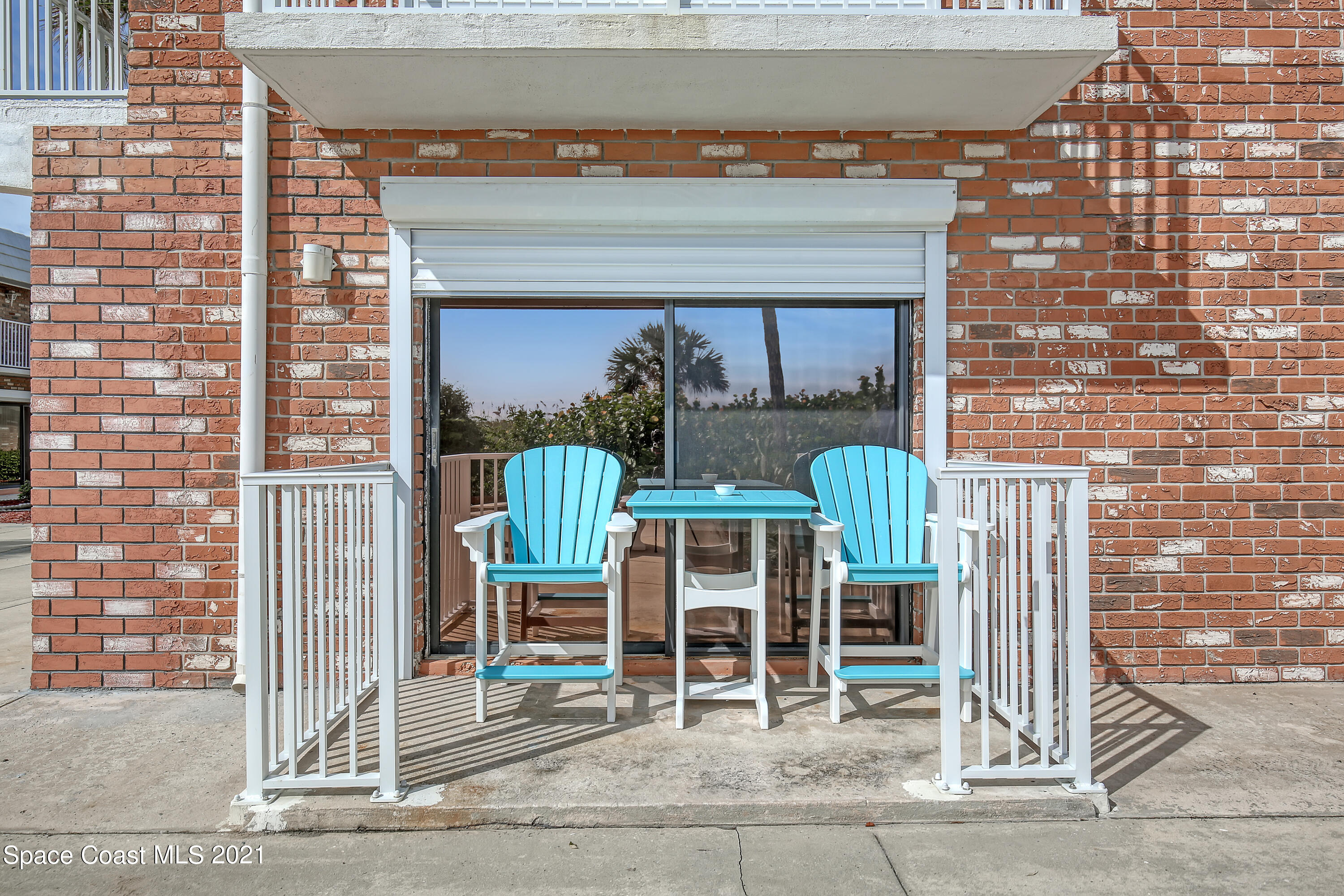 5000 Ocean Beach Boulevard, Unit C5 Cocoa Beach, FL 32931 - Photo 24 of 43 a front view of a house with a porch