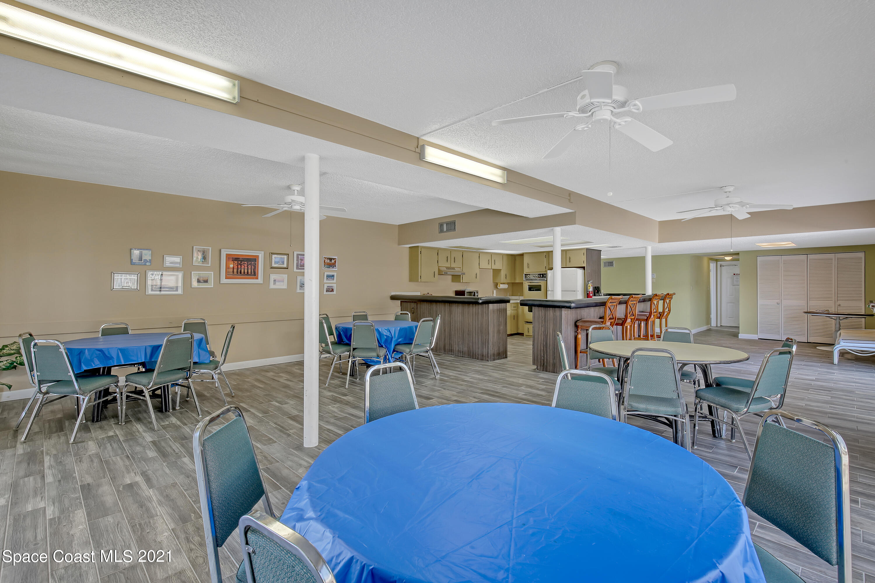 5000 Ocean Beach Boulevard, Unit C5 Cocoa Beach, FL 32931 - Photo 37 of 43 a view of a dining room with furniture and wooden floor
