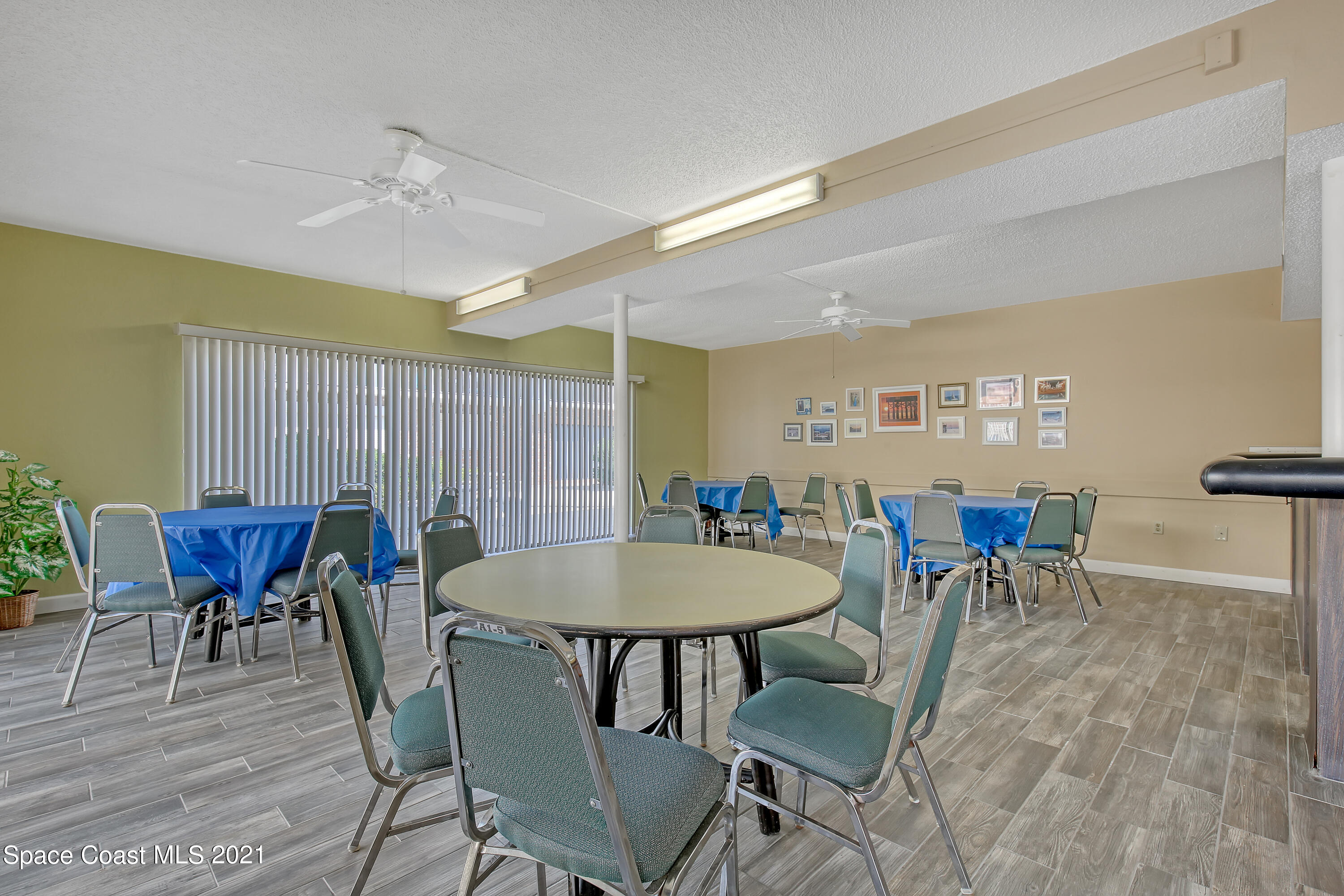 5000 Ocean Beach Boulevard, Unit C5 Cocoa Beach, FL 32931 - Photo 38 of 43 a view of a dining room with furniture and wooden floor