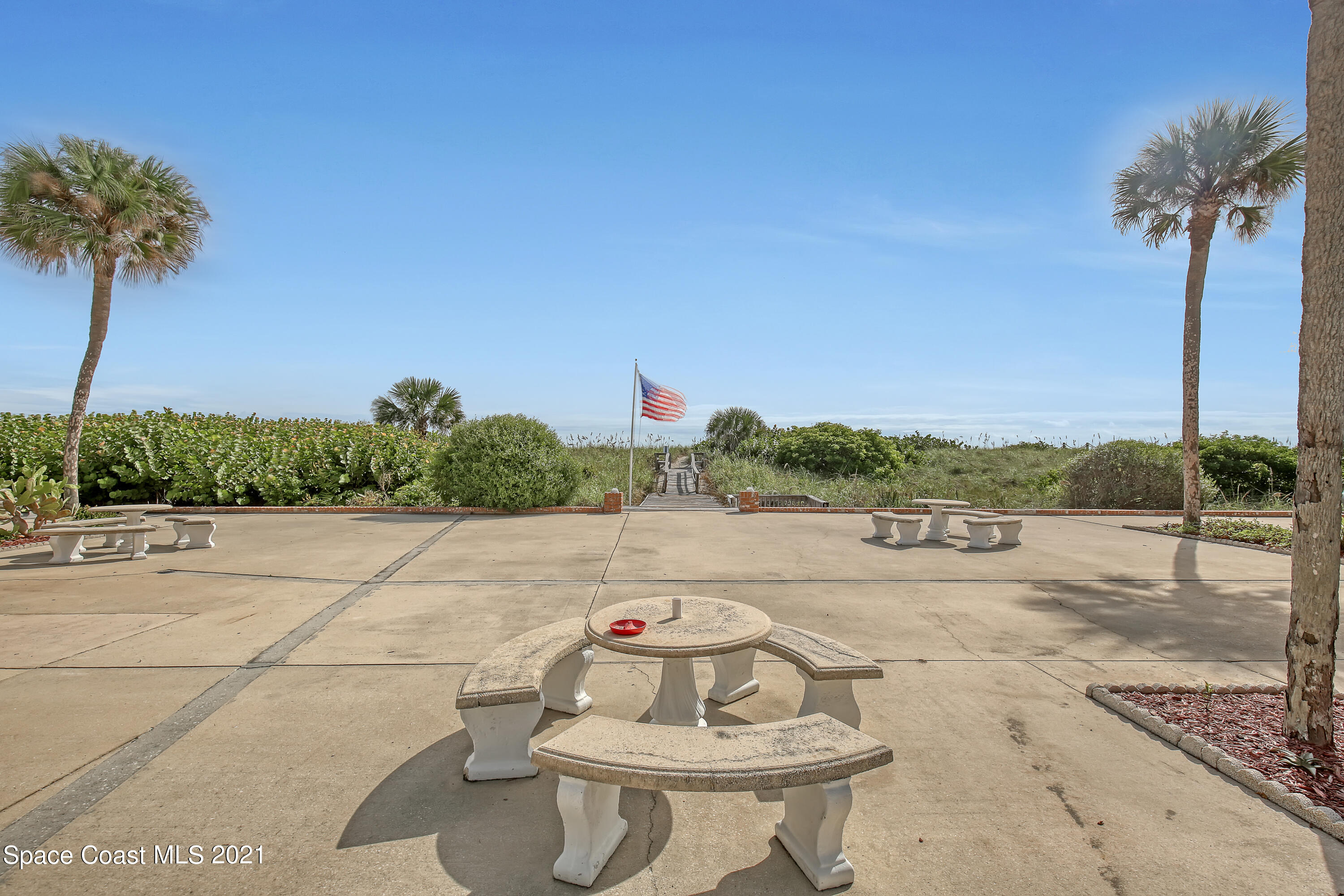 5000 Ocean Beach Boulevard, Unit C5 Cocoa Beach, FL 32931 - Photo 39 of 43 a view of a terrace with couches and sky view