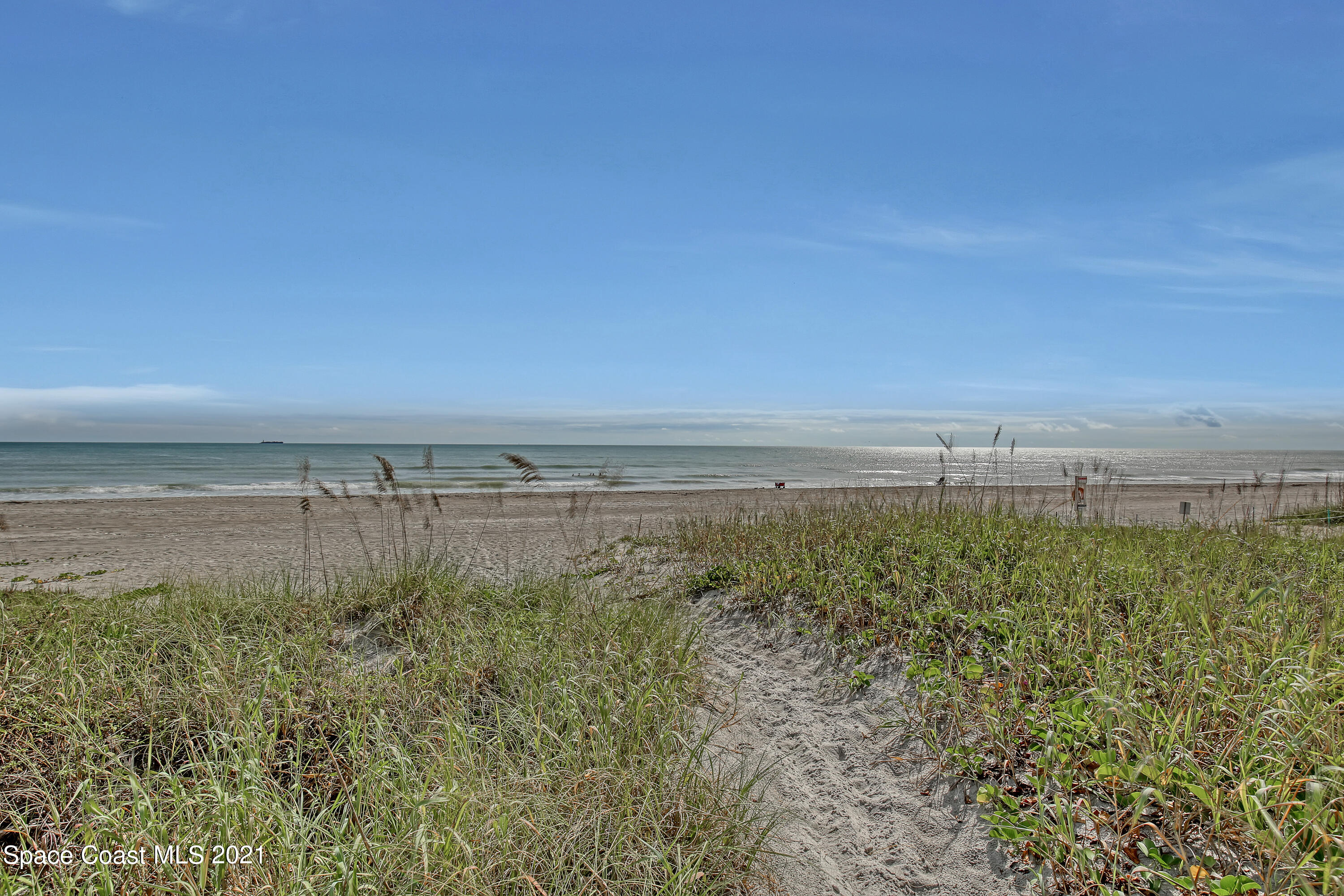5000 Ocean Beach Boulevard, Unit C5 Cocoa Beach, FL 32931 - Photo 40 of 43 a view of a field with an ocean