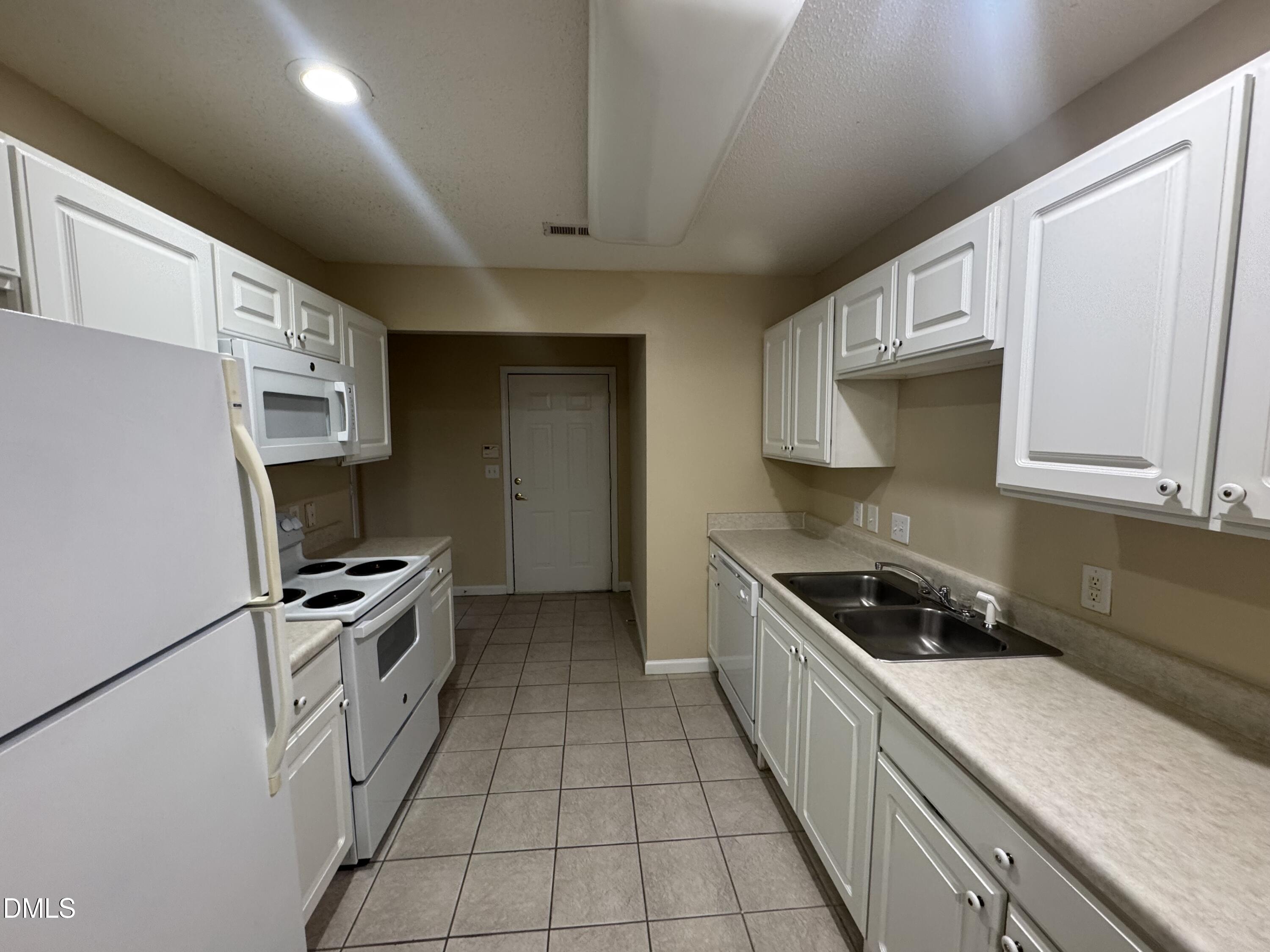 Undisclosed Address Raleigh, NC 27617 - Photo 14 of 22 a kitchen with granite countertop a sink and stainless steel appliances